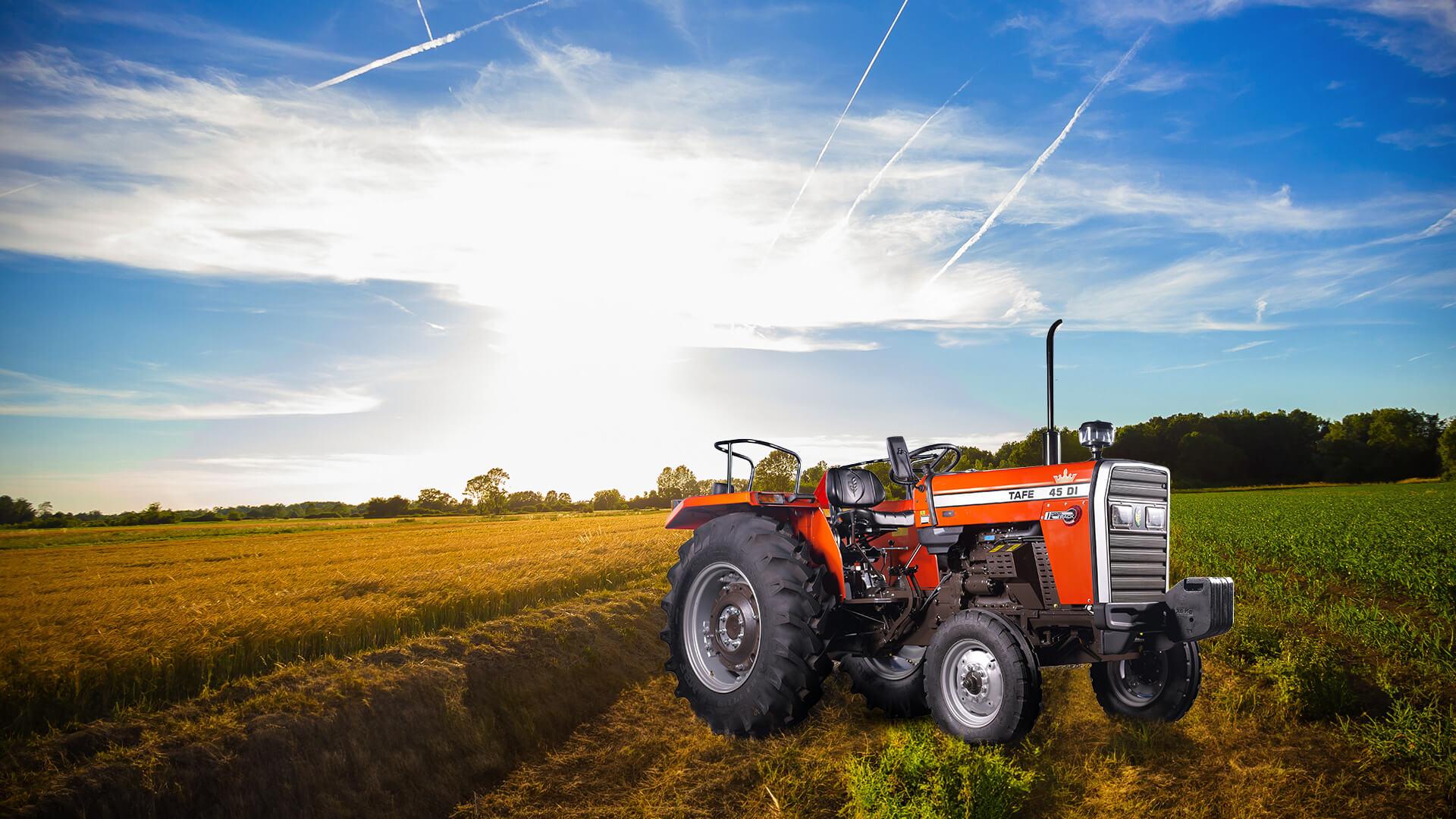 TAFE-45-DI-Dynatrack-WD-Tractor-RuralSetting-GreenGrass-ClearSky.png